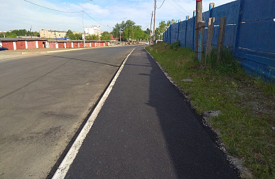 На улице Товарный двор уложили первый слой асфальта